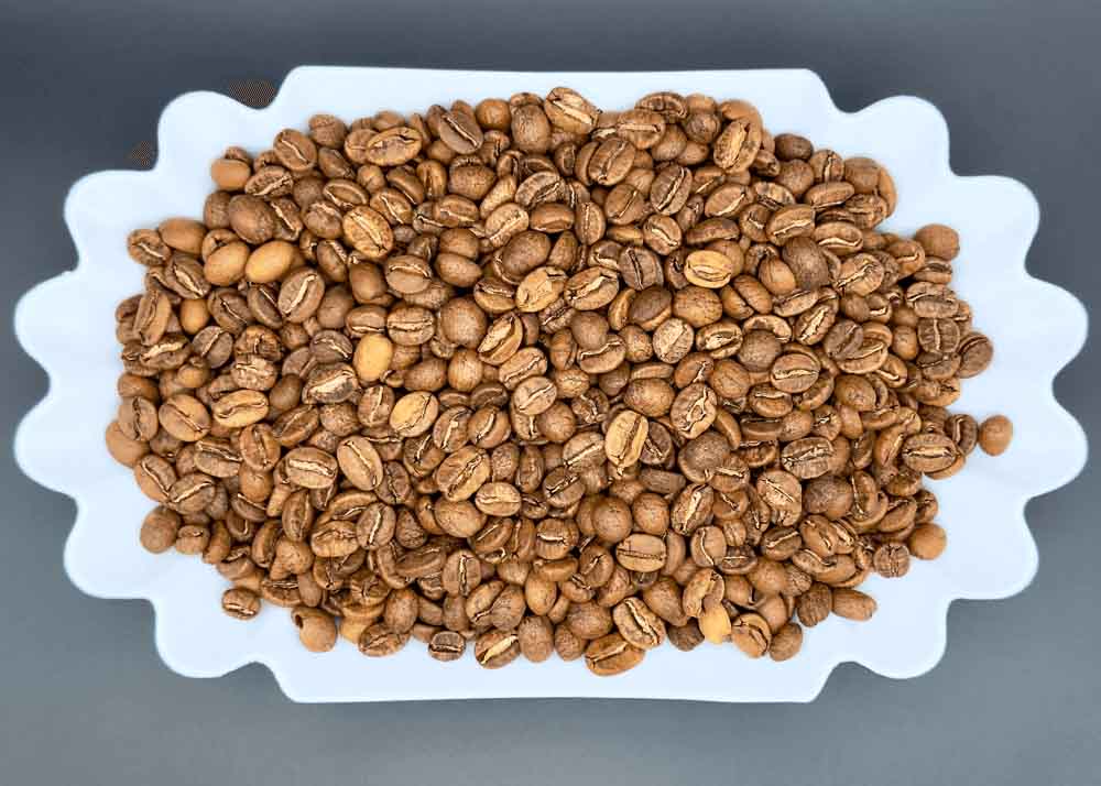 Freshly roasted Argelia Cauca Colombian coffee beans in a dish