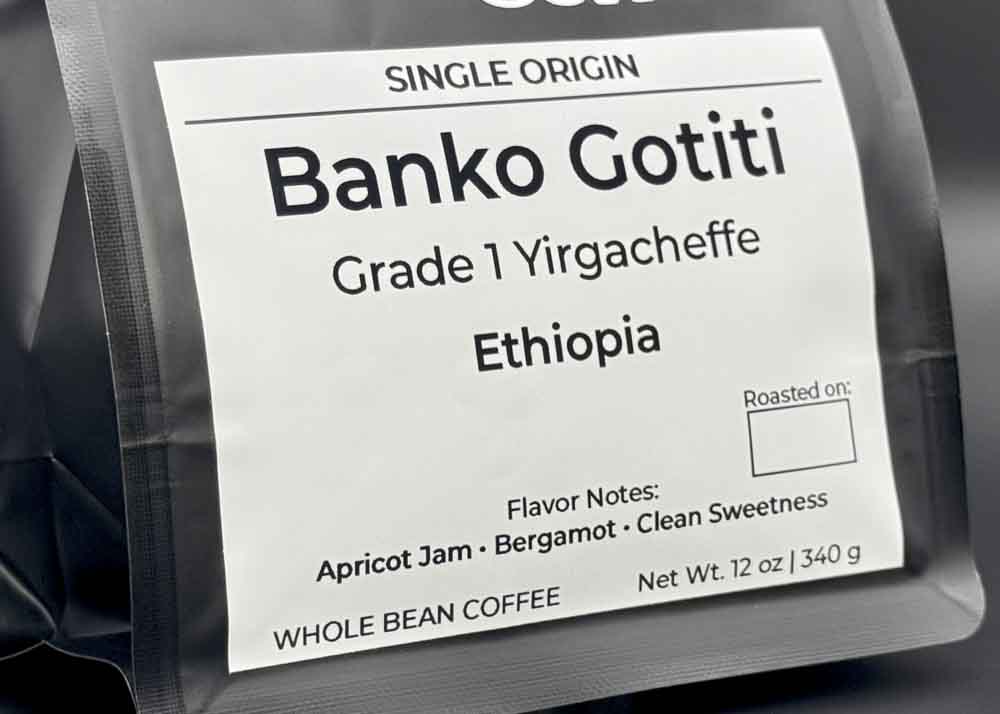 Label close-up of Banko Gotiti Yirgacheffe coffee bag, tasting notes: apricot jam, bergamot, and clean sweetness