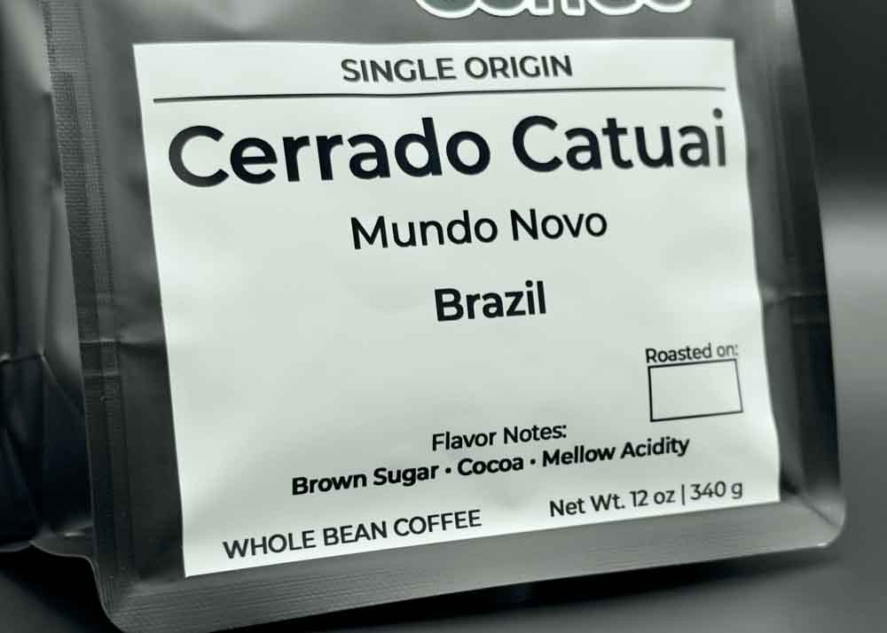 Label close-up of Cerrado Catuai coffee bag, tasting notes: brown sugar, cocoa, and mellow acidity