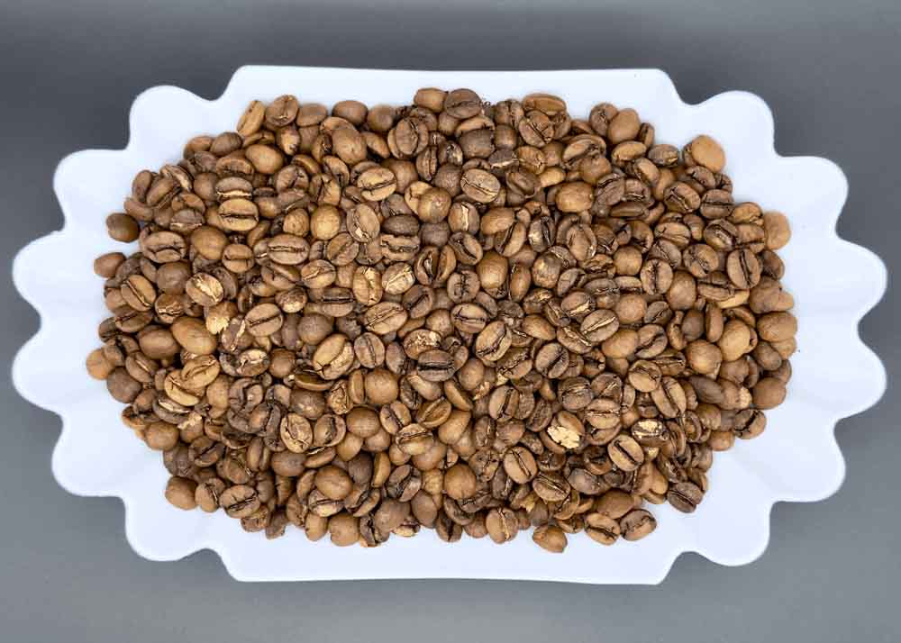 Freshly roasted Cerrado Catuai Brazilian coffee beans in a dish