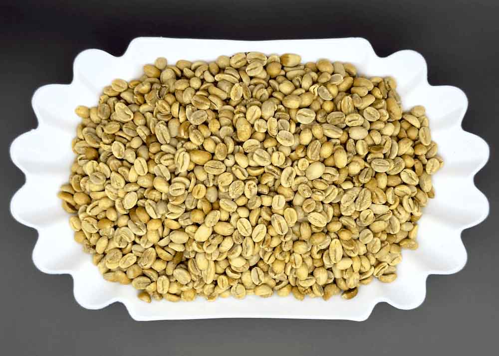 Dish of unroasted green Dembi Sidama Ethiopian coffee beans, natural process