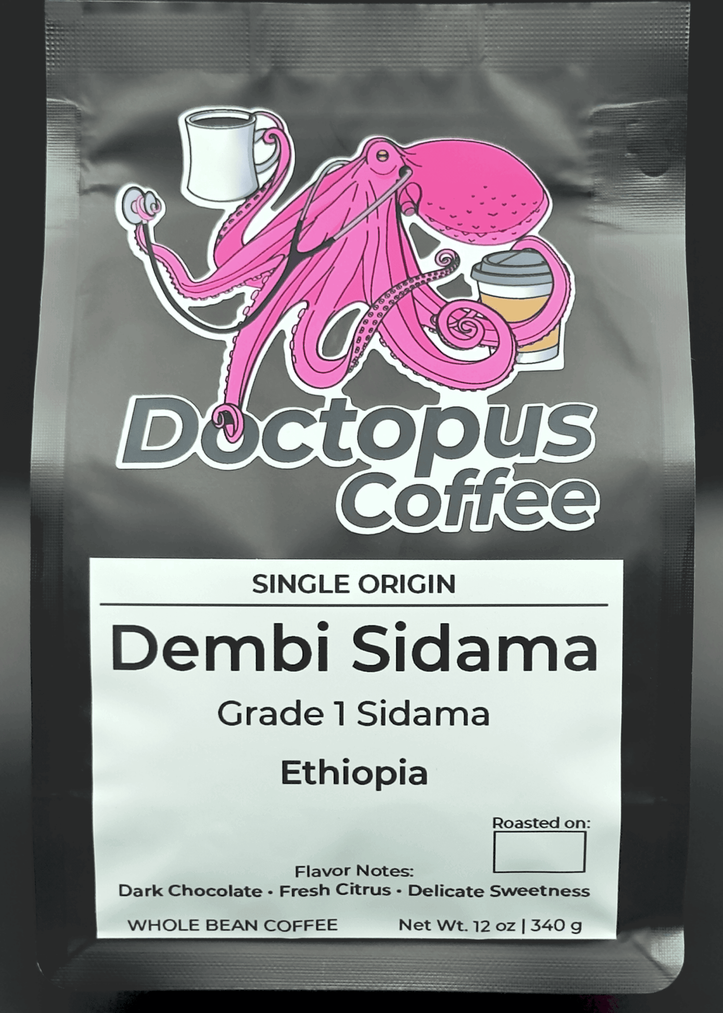 Doctopus Coffee bag featuring pink octopus logo holding coffee cups. Label shows Single Origin Dembi Sidama Grade 1 from Ethiopia with dark chocolate, fresh citrus, and delicate sweetness notes