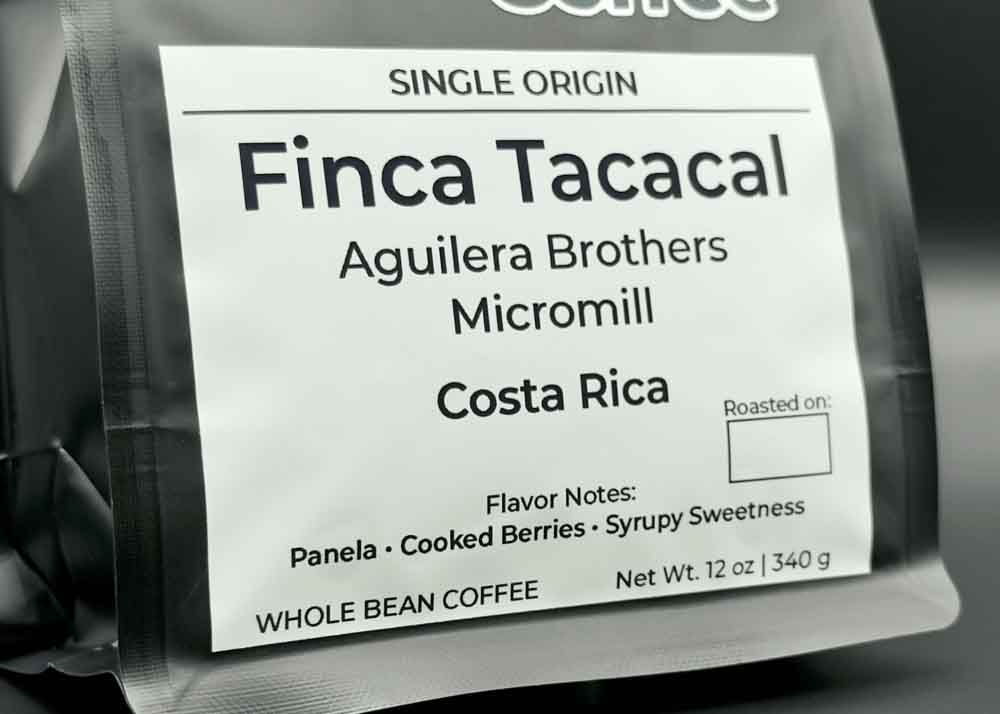 Label close-up of Finca Tacacal coffee bag, tasting notes: panela, cooked berries, and syrupy sweetness